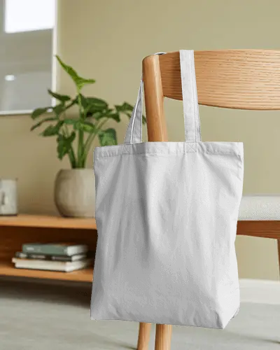 Minimalist Home Tote Bag Mockup Hanging On Wooden Chair In Cozy Interior