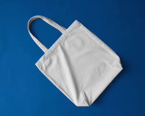 Minimalist Flat Lay Totebag Mockup On Bold Blue Background Clean Fashion Product Display