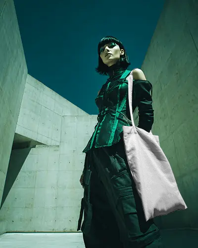 Futuristic Streetwear Totebag Mockup Canvas Bag Carried By Model In Brutalist Concrete Architecture