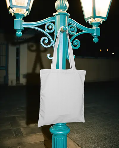 Eco Friendly Tote Bag Mockup Hanging On Vintage Street Lamp For Clean Tote Design Display