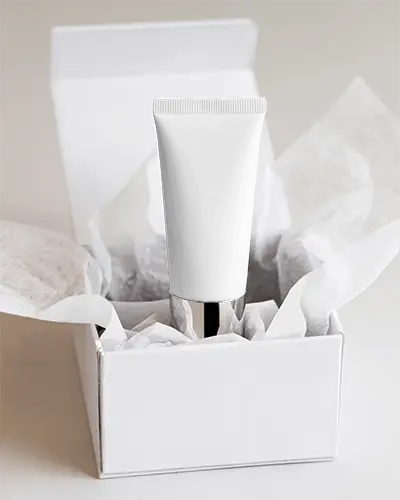 minimalistic-packaging-design-showcasing-tube-inside-clean-white-gift-box