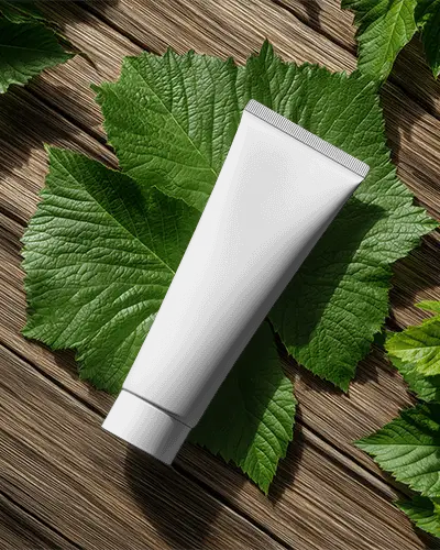eco-friendly-skincare-tube-mockup-packaging-on-natural-wooden-surface-with-green-leaves