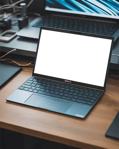 Asus Zenbook Laptop Mockup On Wooden Tech Desk Amidst Multiple Devices And Cables