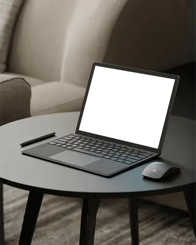 minimalist-home-laptop-mockup-sleek-device-on-round-black-table-in-cozy-living-room