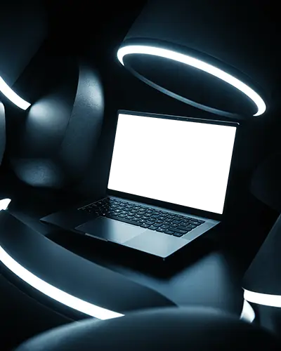 minimalistic-laptop-design-showcased-in-dark-environment-with-glowing-ring-light-highlighting