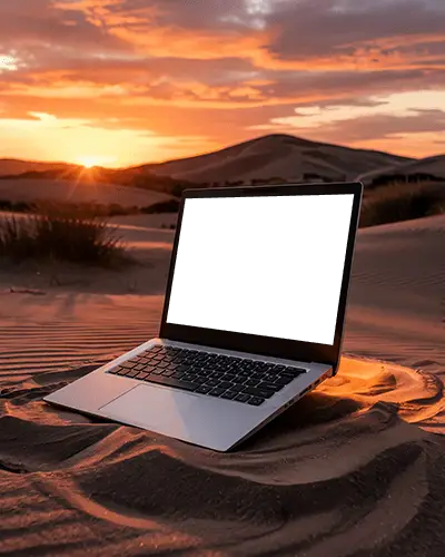 Sunset Desert Laptop Mockup Placed On Textured Sand With Glowing Orange Horizon