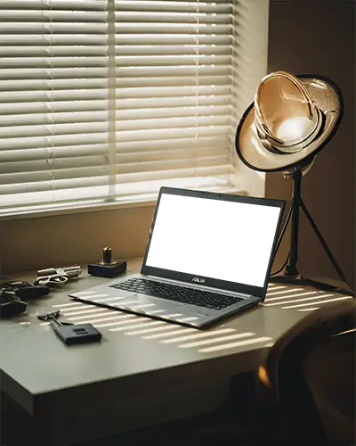 asus-laptop-mockup-on-modern-desk-with-sunlight-and-studio-lamp-in-cozy-home-office