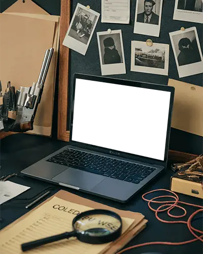 razer-laptop-mockup-on-detective-desk-with-case-files-magnifying-glass-and-photos