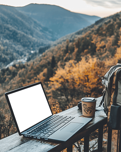 Mountain Retreat Laptop Mockup Outdoor Desk With Backpack And Coffee Cup Serene Nature Setting 024
