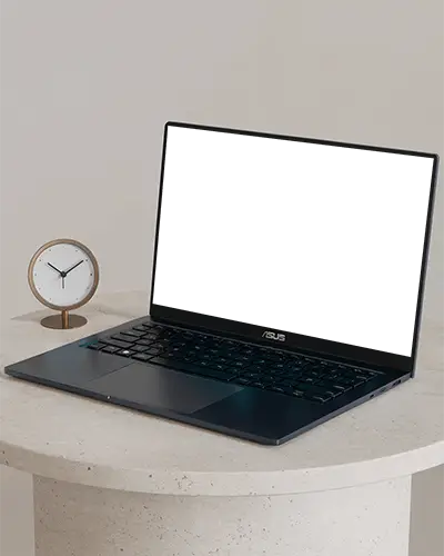modern-laptop-mockup-on-round-table-with-minimalist-clock-in-studio-setting
