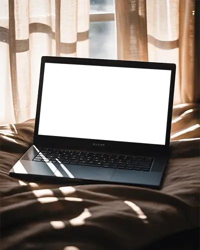 Modern Razer Gaming Laptop Mockup Digital Device On Bed In Soft Sunlight Through Curtains