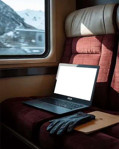 modern-asus-laptop-mockup-digital-device-on-train-seat-with-gloves-and-folder-in-travel-setting