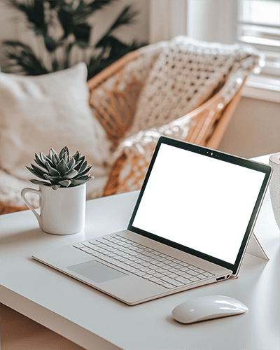 Cozy Home Office Laptop Mockup With Succulent And Mouse On White Desk Boho Chair In Background Soft Natural Light 033