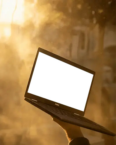 Dell Laptop Mockup Handheld In Bright Sunset Light With Warm Golden Background Glow