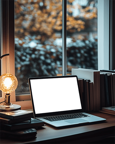 Cozy Evening Laptop Mockup By Window With Books And Warm Lamp Light Autumn Foliage Outside Soft And Inviting Ambience 044