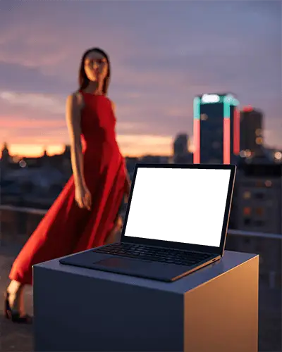 Microsoft Surface Laptop Mockup On Rooftop Pedestal With Elegant Woman In Red Dress At Sunset