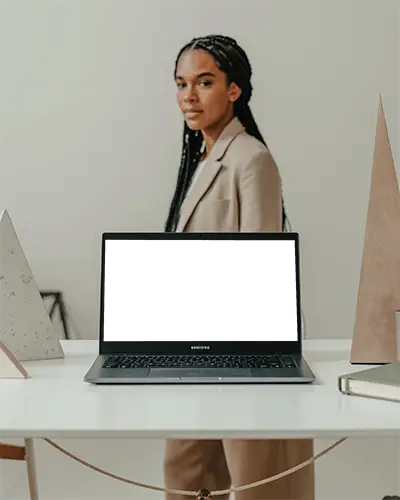 Samsung Laptop Mockup On Desk With Professional Woman In Beige Suit Modern Office Interior Setting
