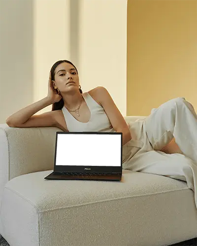 Asus Laptop Mockup On White Sofa With Woman In Elegant White Outfit In Modern Minimal Interior