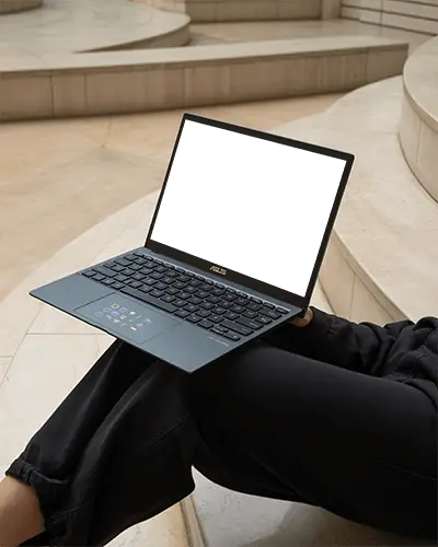 Asus Laptop Mockup On Persons Lap In Modern Architectural Space With Minimal Beige Stone Design