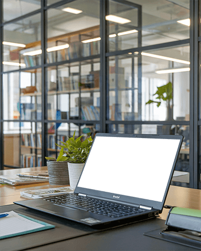 Modern Office Laptop Mockup On Meeting Table With Glass Partitions And Bookshelves Professional And Organized Ambience 056