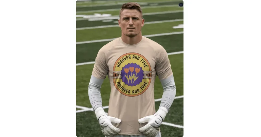 a goalkeeper stands wearing a football jersey