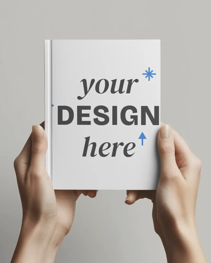 hand holding hardcover book-mockup