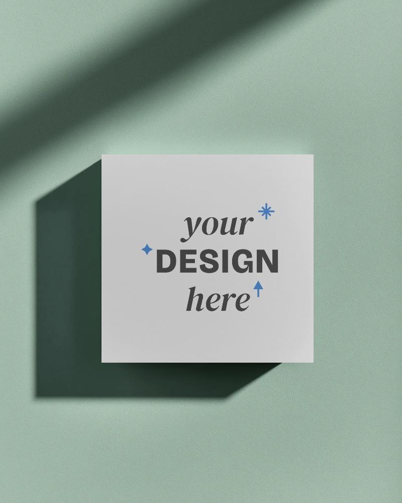 square elevated business card mockup floating on soft mint green textured background with sharp shadow

