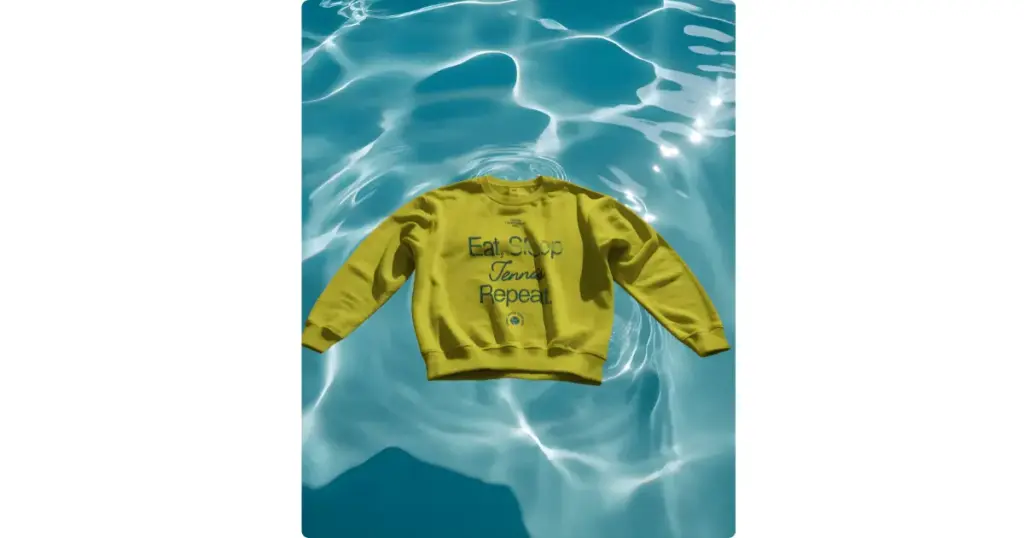 a crewneck sweatshirt sits against the water