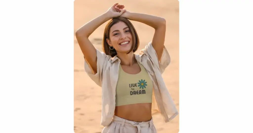 a model on a beach wearing a crop top